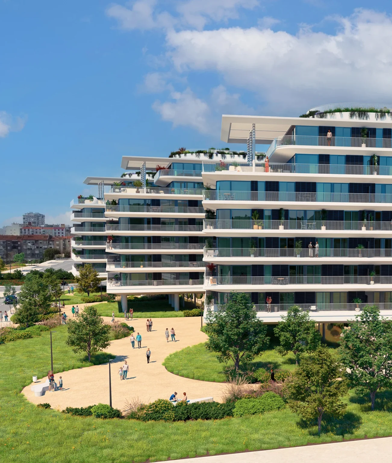 edifício Nooba visto do jardim, com varandas amplas e pessoas a passear nos caminhos ajardinados